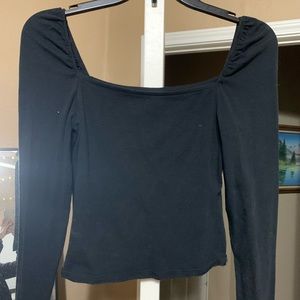 Black top with small puffed sleeves. Size S